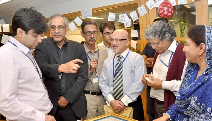 President of Geo and Jang Group Imran Aslam (centre) speaks at an event and can be seen with his younger brother, late editor The News Talat Aslam.