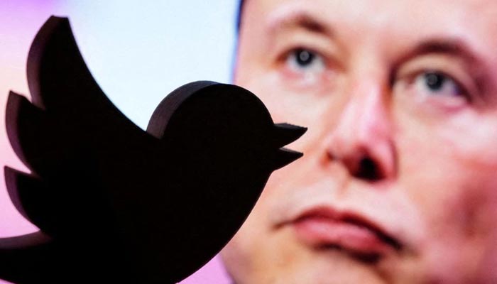 A 3D printed Twitter logo is seen in front of a displayed photo of Elon Musk in this illustration taken October 27, 2022. — Reuters/File