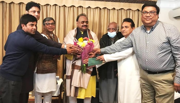 Witnesses Mustafa Azizabadi and Qasim Ali Raza with MQM founder Altaf Hussain. -Picture by author