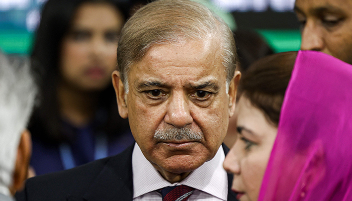 Prime Minister Shahbaz Sharif (C) speaks with delegates after a joint press conference with the UN secretary-general at the Pakistani pavilion at the COP27 climate conference at Sharm el-Sheikh International Convention Centre in Egypt´s Red Sea resort city of the same name on November 7, 2022. — AFP