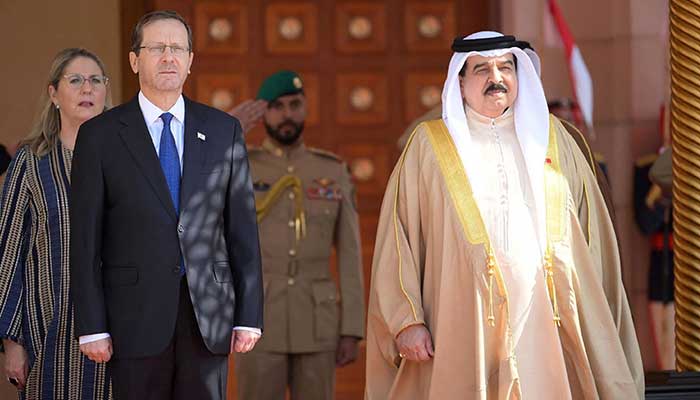 In this handout picture obtained from the Israeli Government Press Office (GPO), Bahrains King Hamad bin Isa al-Khalifa (right) receives Israeli President Isaac Herzog in the capital Manama, on December 4, 2022. — AFP