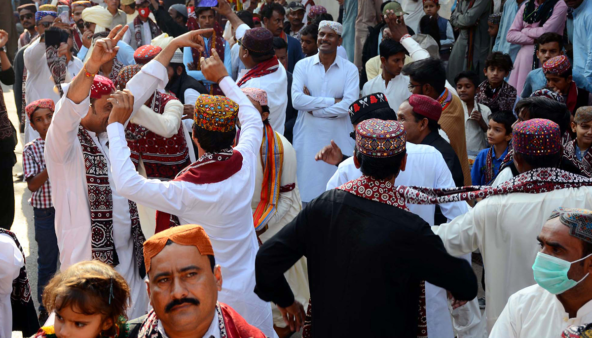 A large number of people can be seen wearing Sindh traditional dresses as they hold a celebration demonstration in connection relation to Sindhi Culture Day in Hyderabad on December 04, 2022. — PPI