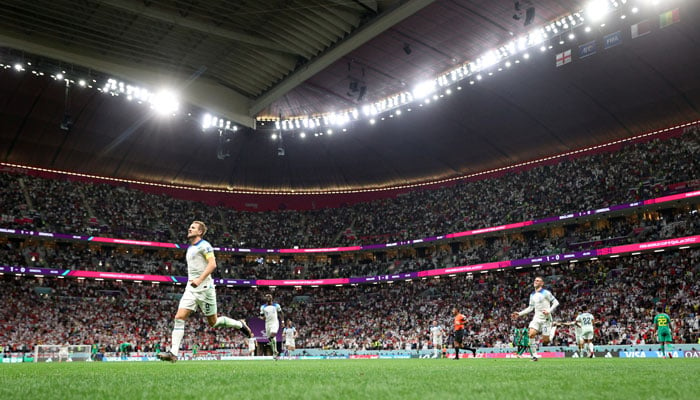 Englands Harry Kane celebrates scoring their second goal against Senegal in their Round of 16 match of the FIFA World Cup. — Reuters