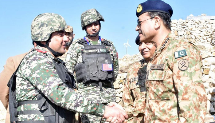 Chief of Army Staff General Asim Munir shakes hands with a soldier at Pakistan-Afghanistan border in Tirah Valley.— ISPR