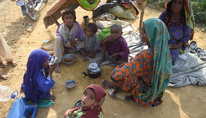 Internally displaced flood-affected people take refuge at a makeshift camp in Jamshoro district of Sindh province on September 26, 2022. — AFP