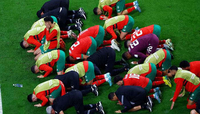 Soccer Football - FIFA World Cup Qatar 2022 - Round of 16 - Morocco v Spain - Education City Stadium, Al Rayyan, Qatar - December 6, 2022 Morocco team members celebrate after the match as Morocco qualify for the quarter finals. — Reuters