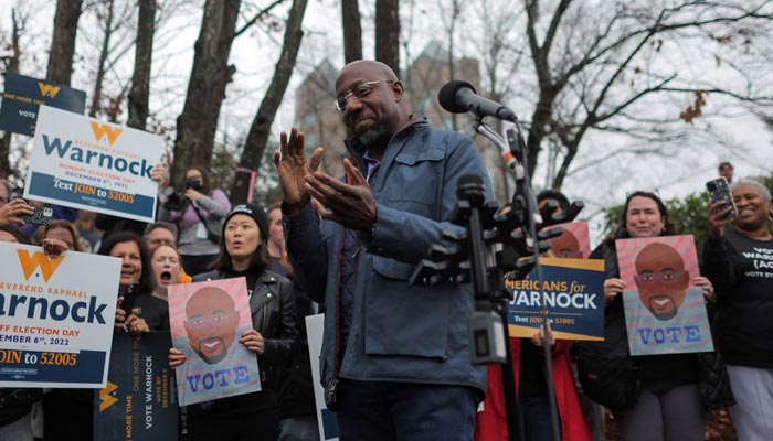 Reverend Raphael Warnock, Democratic Senator for Georgia, delivers remarks during a visit at a campaign office during the midterm Senate runoff elections in Norcross, Georgia, U.S., December 6, 2022. — Reuters