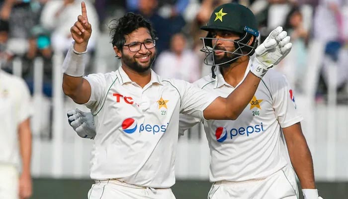 Pakistan openers Imam-ul-Haq (L) celebrates after scoring a century with Abdullah Shafique — AFP/File