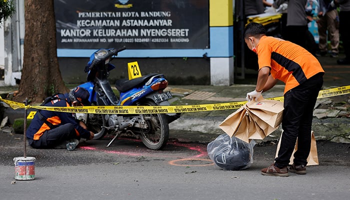 Indonesia Automatic Fingerprint Identification System (INAFIS) officers collect evidence following a blast at a district police station, that according to authorities was a suspected suicide bombing, in Bandung, West Java province, Indonesia, December 7, 2022. — Reuters