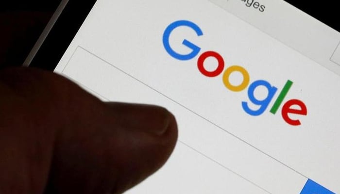 A man holds his smartphone which displays the Google home page, in this picture illustration taken in Bordeaux, Southwestern France, August 22, 2016. — Reuters