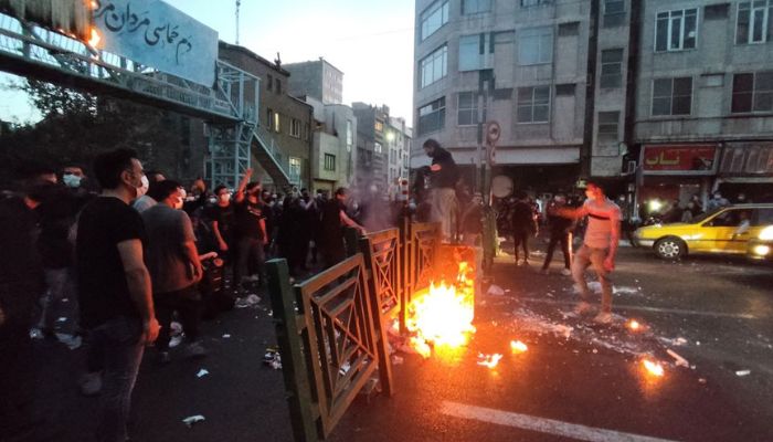 People light a fire during a protest over the death of Mahsa Amini, a woman who died after being arrested by the Islamic republics morality police, in Tehran, Iran September 21, 2022.— Reuters