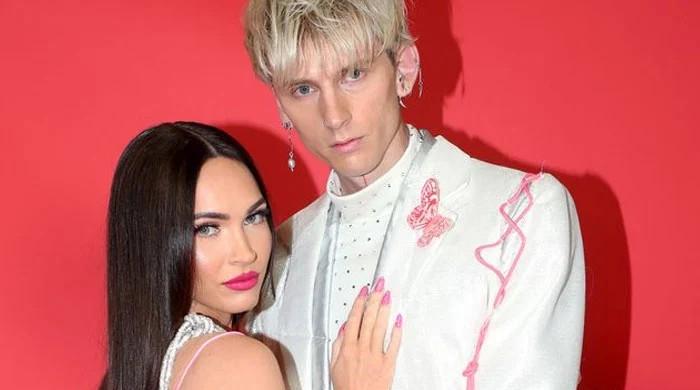 Machine Gun Kelly shares insight into his ‘solid’ relationship with fiancé Megan Fox