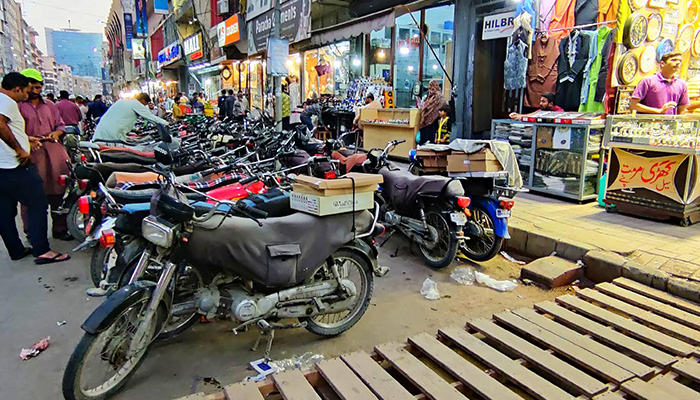 A view of illegal motorbike parking creating hurdles for visitors at Sadar bazaar in Karachi, December 29, 2022. — INP