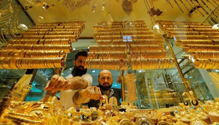 Two gold dealers displaying jewellery. — Reuters/File