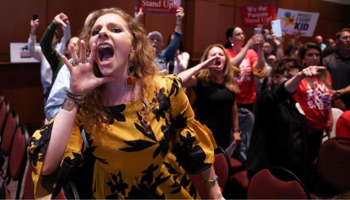 Angry parents and community members protest after a Loudoun County School Board meeting was halted by the school board because the crowd refused to quiet down, in Ashburn, Virginia, June 22, 2021.— Reuters