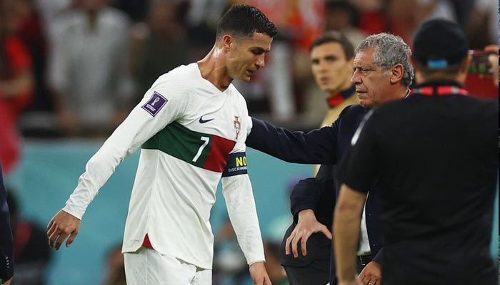 Portugals Cristiano Ronaldo and coach Fernando Santos look dejected after the match as Portugal are eliminated from the World Cup atAl Thumama Stadium, Doha, Qatar on December 10, 2022. — Reuters