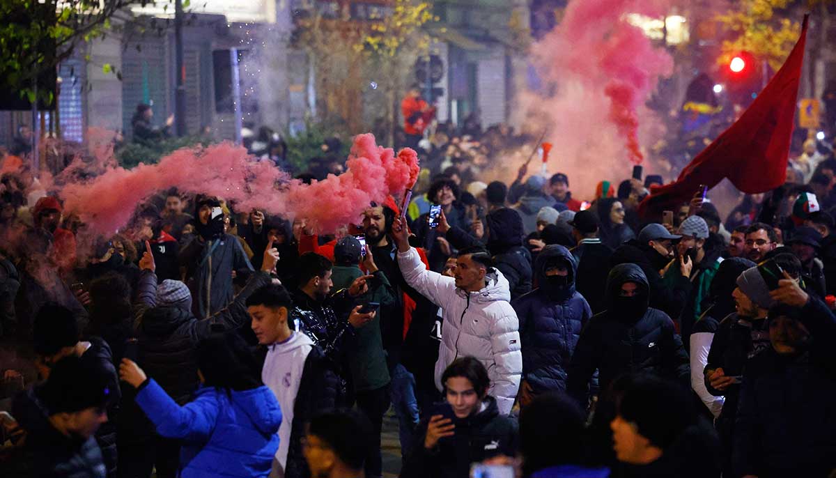 Fans let off smoke bombs in Brussels. —Reuters