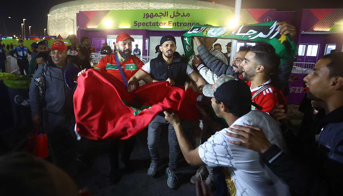 Morocco fans celebrate outside the stadium in Doha. — Reuters