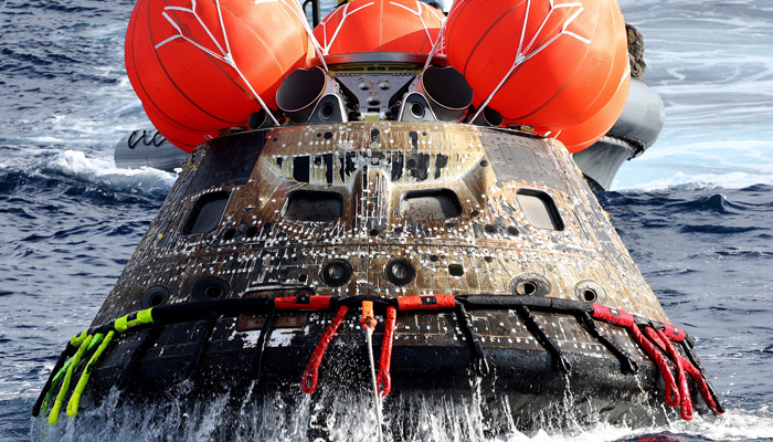 NASAs Orion Capsule is drawn to the well deck of the U.S.S. Portland after it splashed down following a successful uncrewed Artemis I Moon Mission on December 11, 2022 in the Pacific Ocean off the coast of Baja California, Mexico. —REUTERS