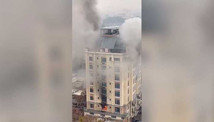 View of a hotel fire in Shahr-e-Naw neighbourhood where gunfire was also heard in Kabul, Afghanistan December 12, 2022, in this still image from a social media video. — Reuters