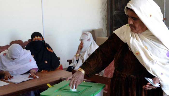 A woman casts here vote in Balochistan. — Reuters/File