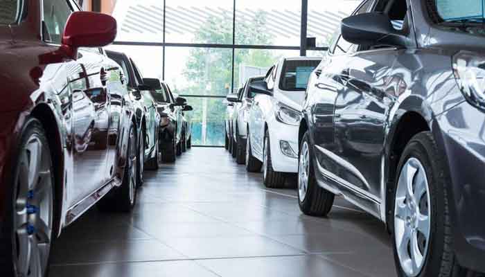 New cars are displayed at a showroom in this undated photo. — File