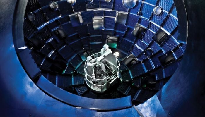 Technicians use a service system lift to access the target chamber interior for inspection and maintenance at the National Ignition Facility (NIF), a laser-based inertial confinement fusion research device, at Lawrence Livermore National Laboratory federal research facility in Livermore, California, United States in 2008.— Reuters