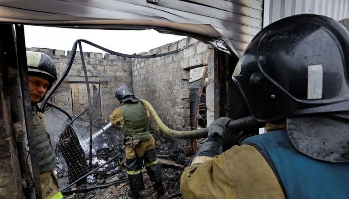Firefighters work at a local market hit by shelling in the course of Russia-Ukraine conflict in Donetsk, Russian-controlled Ukraine, December 12, 2022.— Reuters