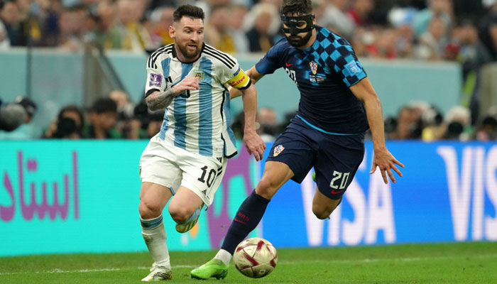 Argentinas Lionel Messi (left) and Croatias Josko Gvardiol battle for the ball during the FIFA World Cup Semi-Final match at the Lusail Stadium in Lusail, Qatar. AFP