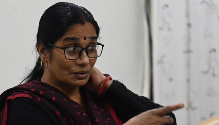 In this photograph taken on November 30, 2022, Asha Devi, mother of the 2012 Delhi gang rape victim, gestures during an interview with AFP at her residence in New Delhi. — AFP