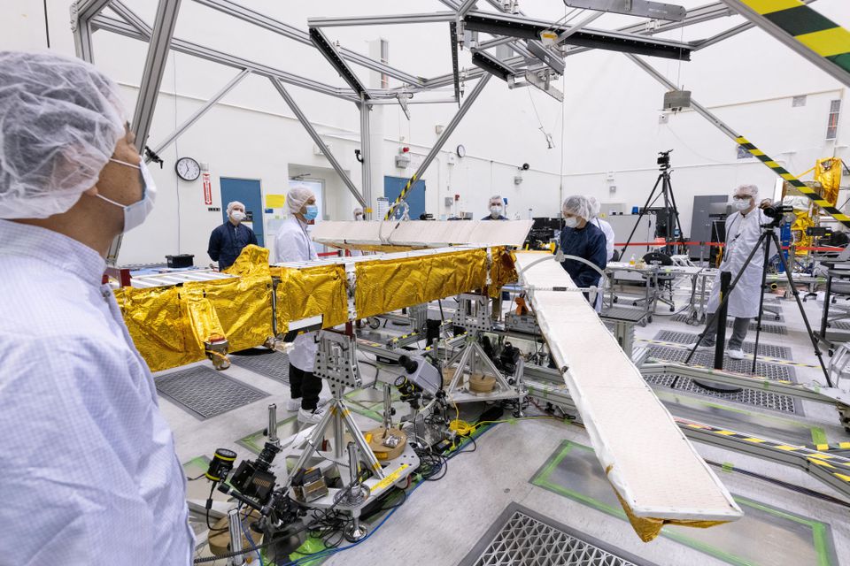 Members of the international Surface Water and Ocean Topography (SWOT) radar satellite mission test one of the antennas for the Ka-band Radar Interferometer (KaRIn) instrument in a clean room at NASAs Jet Propulsion Laboratory in Pasadena, California in 2022.— Reuters
