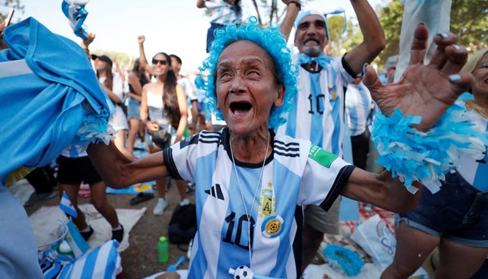 An Argentina fan celebrates after Argentina's Lionel Messi scores their first goal in Buenos Aires, Argentina on December 13, 2022. — Reuters