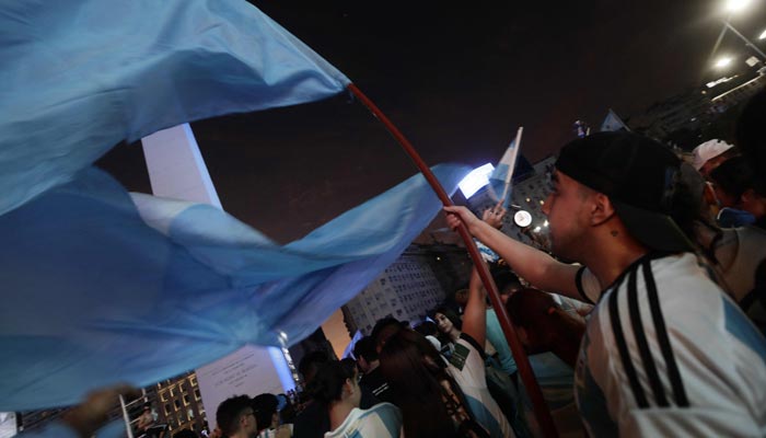 Fans of Argentina celebrate their team´s victory after the Qatar 2022 World Cup semifinal football match between Croatia and Argentina at the Obelisk in Buenos Aires on December 13, 2022. — AFP