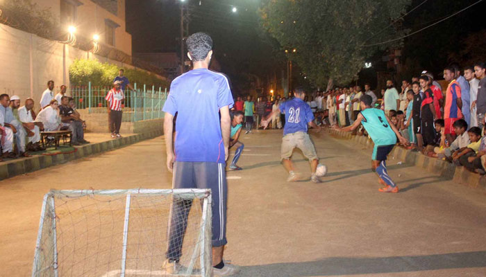 Children play football in Karachis Lyari neighbourhood. — Shahzaib Ali/The News/File