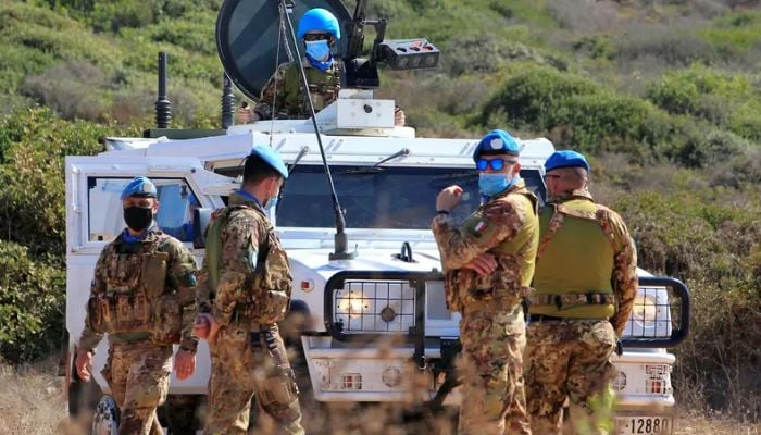 UN peacekeepers (UNIFIL) stand near a UN vehicle in Naqoura, near the Lebanese-Israeli border, southern Lebanon October 14, 2020.— Reuters