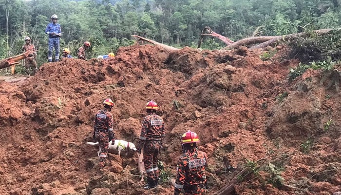Rescuers work during a rescue and evacuation operation following a landslide at a campsite in Batang Kali, Selangor state, on the outskirts of Kuala Lumpur, Malaysia, December 16, 2022. — Reuters