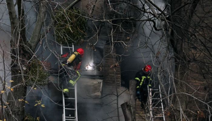 Firefighters work to put out a fire in a residential building hit by a Russian strike, amid Russias attack on Ukraine, in Kyiv, Ukraine November 15, 2022.— Reuters