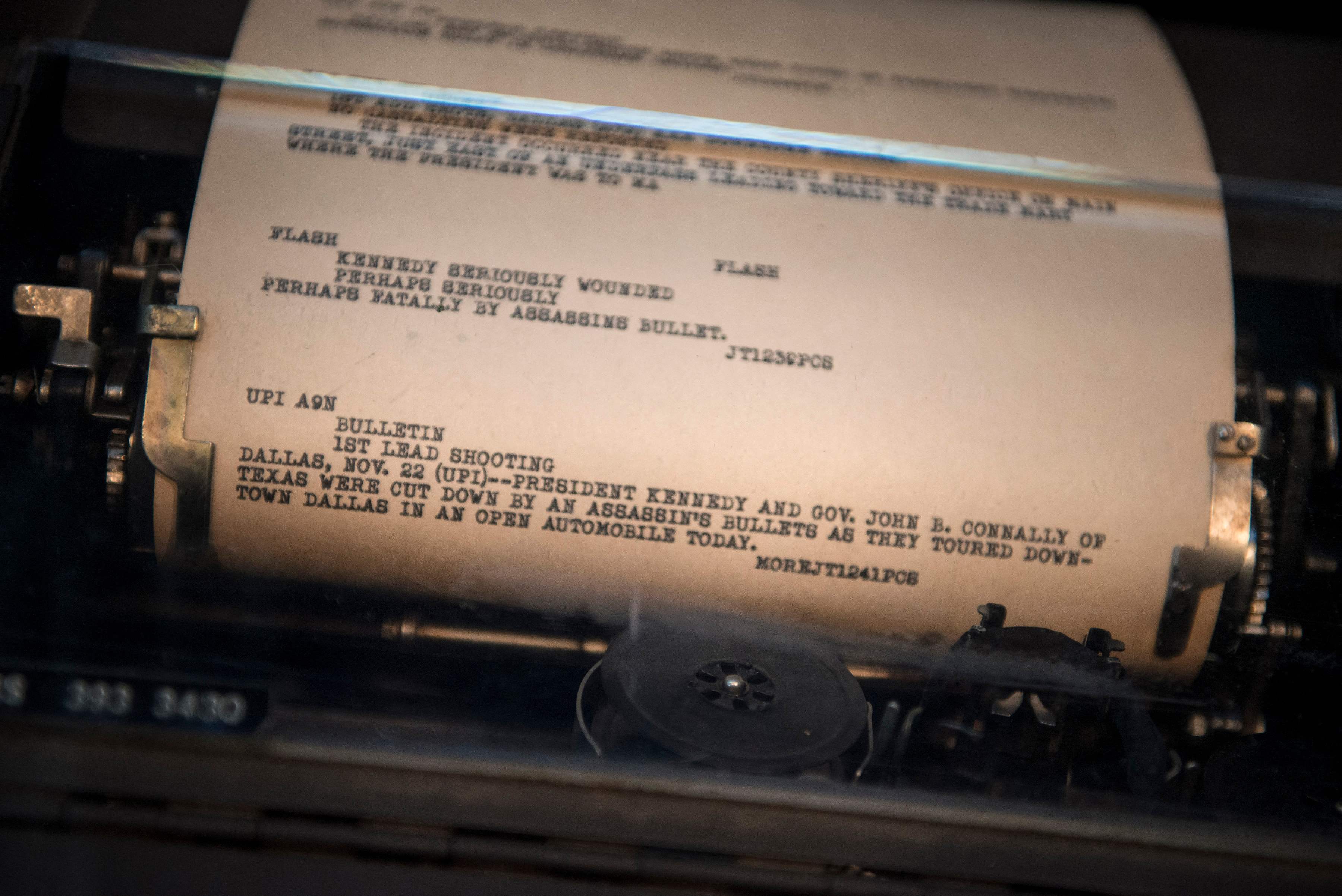 In this file photo taken on September 26, 2013, apage from the UPI newswire is displayed in a teletype reporting the assassination of US President John F. Kennedy at the Newseum in Washington, DC.— AFP