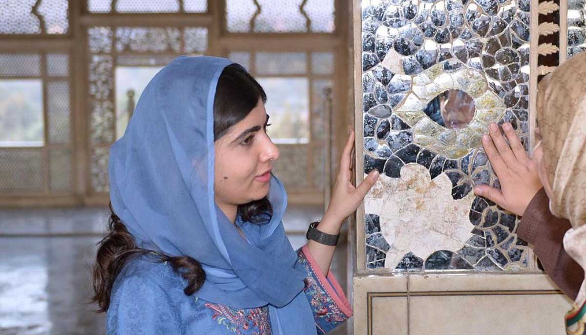 Malala gets briefed about the interior structure of the Lahore Fort on December 16, 2022. — Instagram/Malala