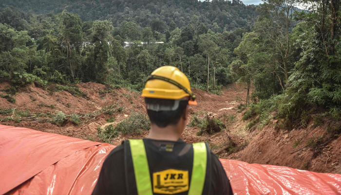 Rescue work is underway after a landslide in Batang Kali town near Kuala Lumpur. — AFP
