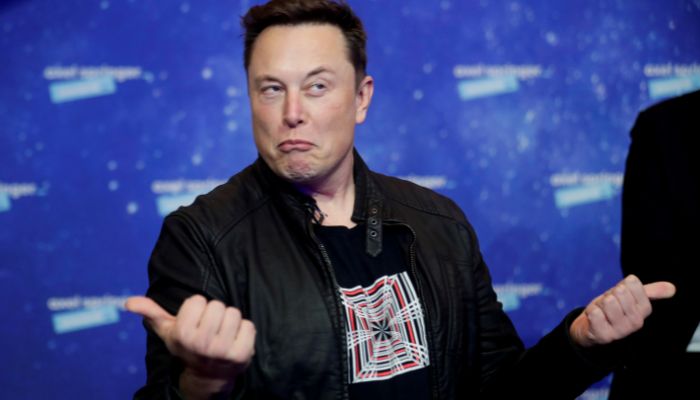 SpaceX owner and Tesla CEO Elon Musk grimaces after arriving on the red carpet for the Axel Springer award, in Berlin, Germany, December 1, 2020.— Reuters