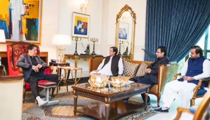 Chief Minister Punjab Chaudhry Parvez Elahi (first right) meets Pakistan Tehreek-e-Insaf (PTI) Chairman Imran Khan (left in Lahore on December 17, 2022. — Twitter/ChParvezElahi