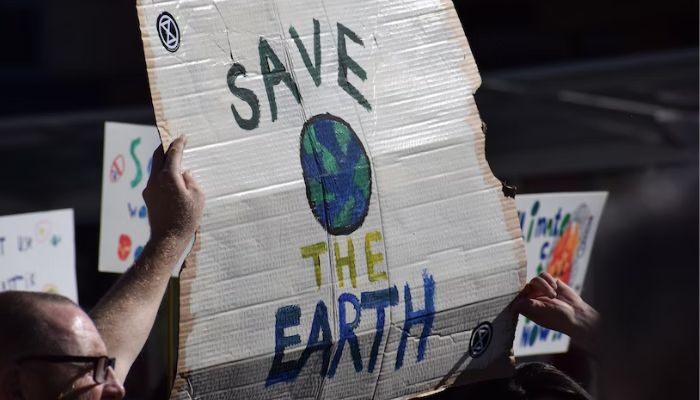 Image shows Save the Earth sign.— Unsplash