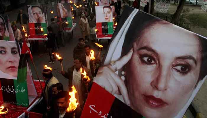 Supporters of slain leader Benazir Bhutto rally in Lahore, Pakistan, in 2013 on the sixth anniversary of her death. —Agencies/file