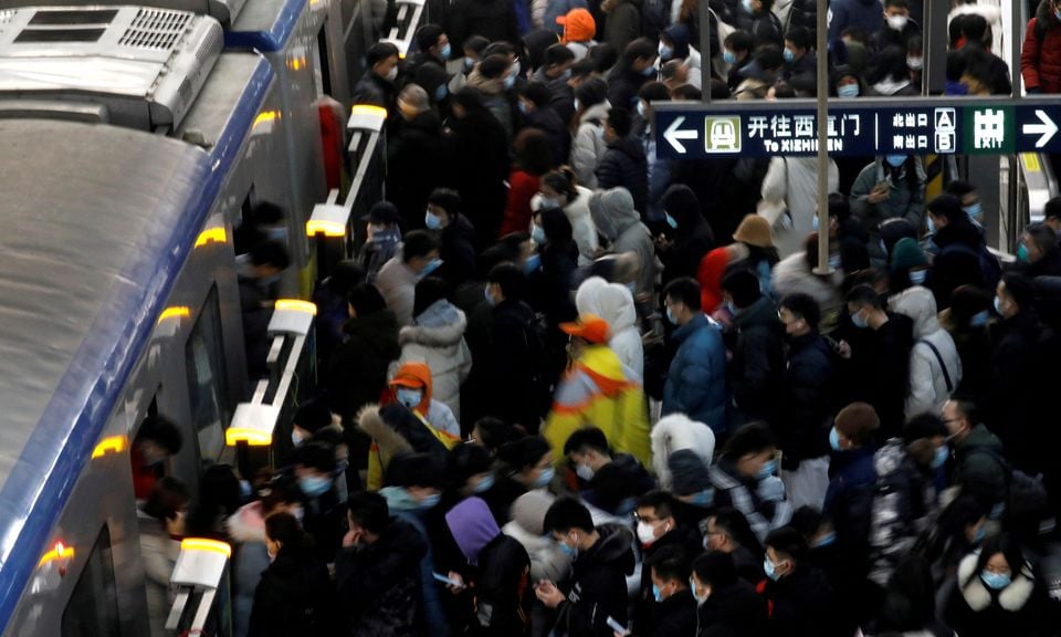 People wearing face masks commute in a subway station during morning rush hour, following the coronavirus disease ( COVID-19) outbreak, in Beijing, China January 20, 2021.— Reuters