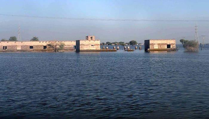 A view of rising flood water following rains and floods during the monsoon season on the outskirts of Khairpur Nathan Shah on October 14, 2022. — INP