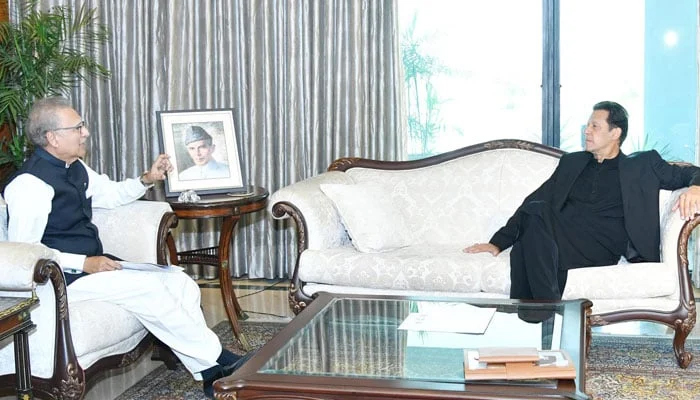 President Arif Alvi (left) meets PTI Chairman Imran Khan in this undated photo. — Facebook/File