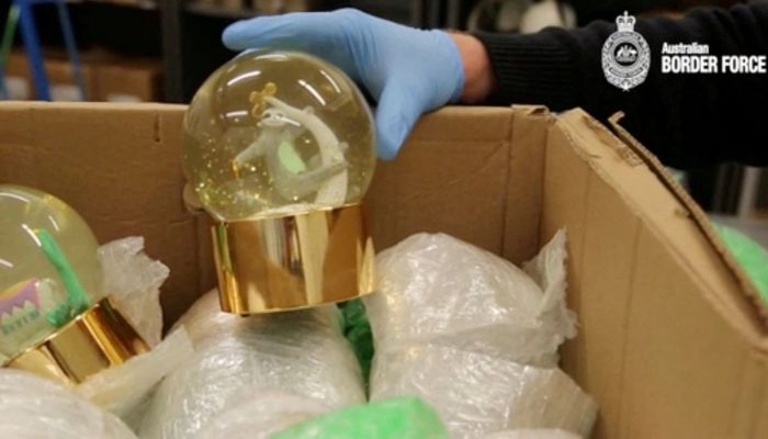 Australian Border Force officer unveils snow globes containing liquid methamphetamine in Sydney, Australia May 31, 2019 in this still image taken from video on July 25, 2019.— Reuters