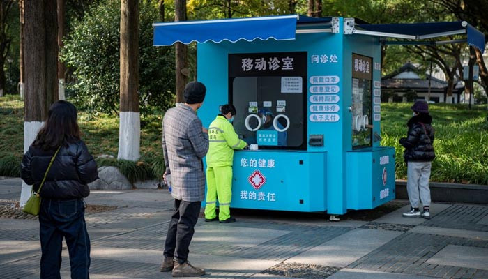 China’s stretched health system braces for peak in COVID infections