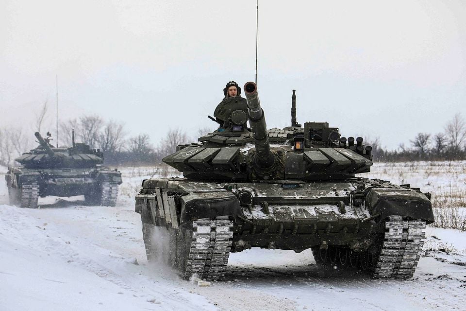 Russian servicemen drive tanks during military exercises in the Leningrad Region, Russia ahead of the Ukraine invasion, in this handout picture released February 14, 2022.— Reuters